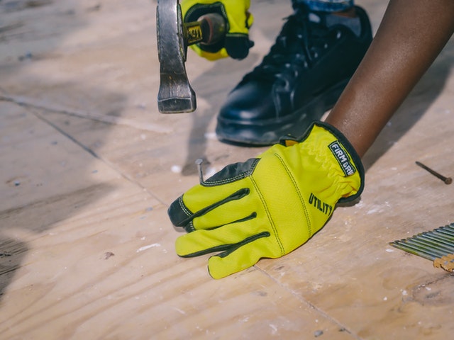 https://presidioroof.com/wp-content/uploads/2021/07/Hammering-a-nail-into-roof.jpg