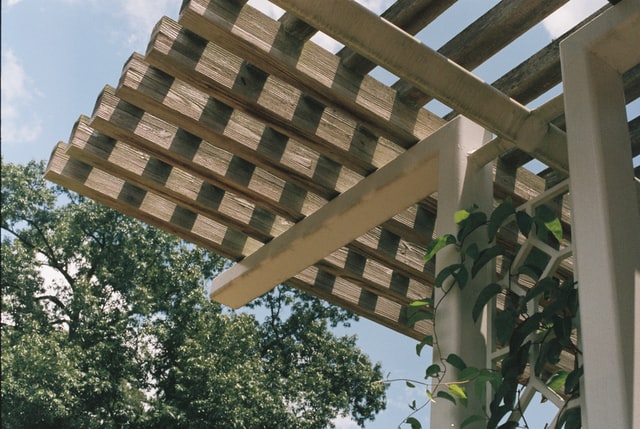 How to Attach a Pergola to a House with Gutters
